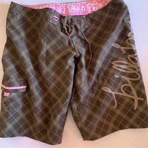 brown and pink billabong board shorts